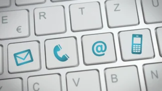 A close up of a keyboard with various icons on it.