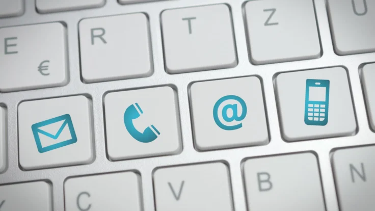 A close up of a keyboard with various icons on it.