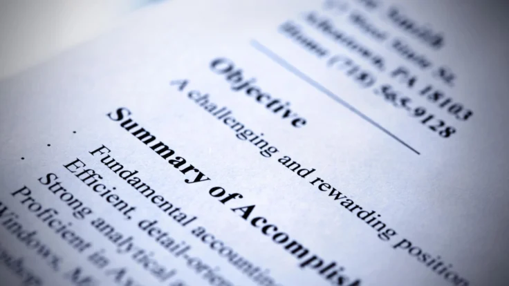 A close up of a document with a summary of accomplishments.