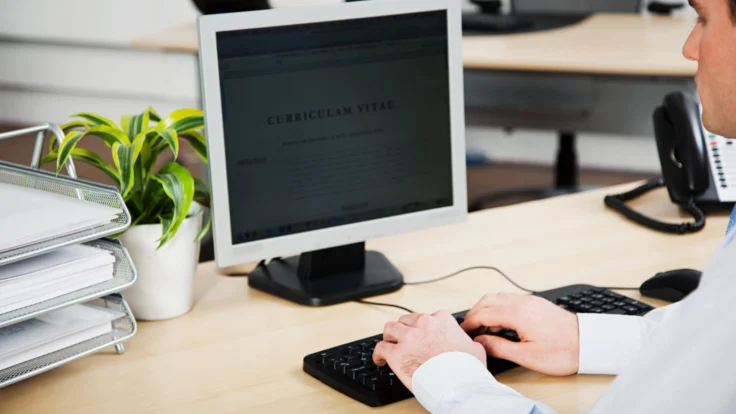 A man typing on a computer.