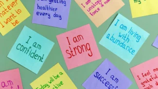 A group of sticky notes with the words i am strong.