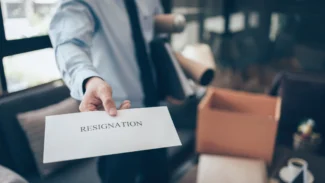 A man is holding a paper with the word relocation.