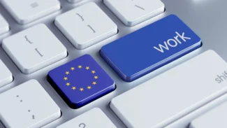 An eu flag on a keyboard with the word work.